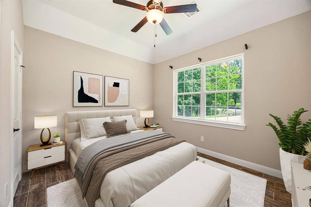 Sunlit secondary bedroom with a roomy closet, perfect for guests or growing kids. *Virtually Staged