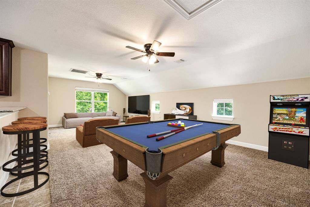 Spacious garage apartment featuring a full kitchenette, dining area, and plenty of room for entertaining or relaxing. *Virtually Staged