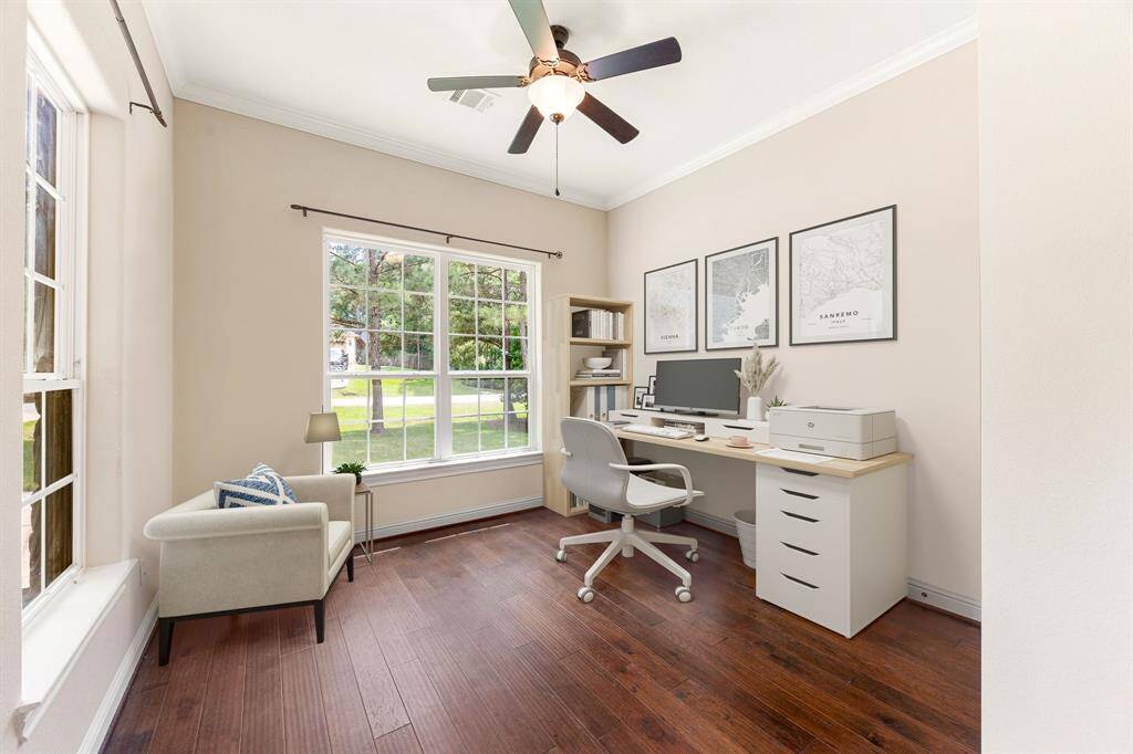 Secondary bedroom great for use as a home office or guest suite features high ceilings, lovely modern ceiling fan, custom paint, wood style flooring, space for seating area, direct access to the secondary bathroom and large window with plenty of naturlal light. *Virtually Staged