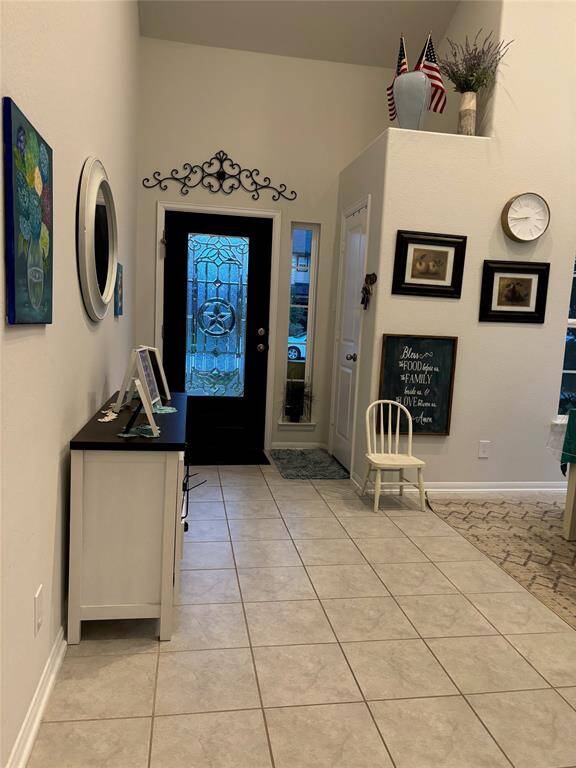 beautiful glass door and coat closet as you come in.