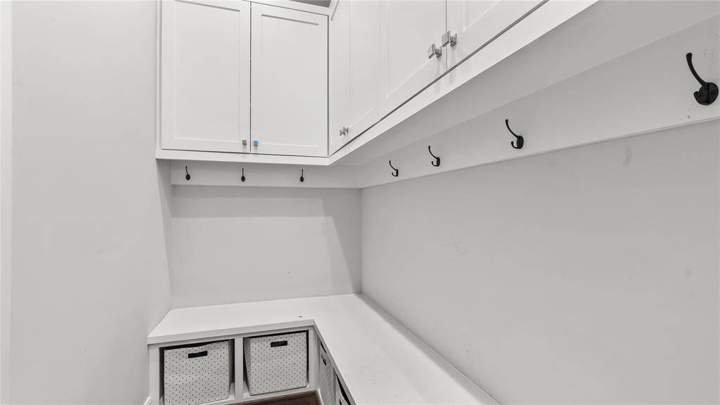 Downstairs mudroom has ample storage for outerwear, shoes, umbrellas and much, much more.