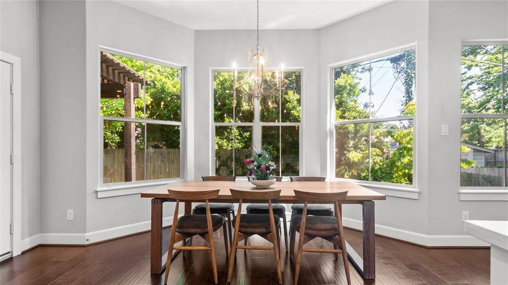 Bringing the outside in, the dining room is sun lit by day and chandelier lit by night.
