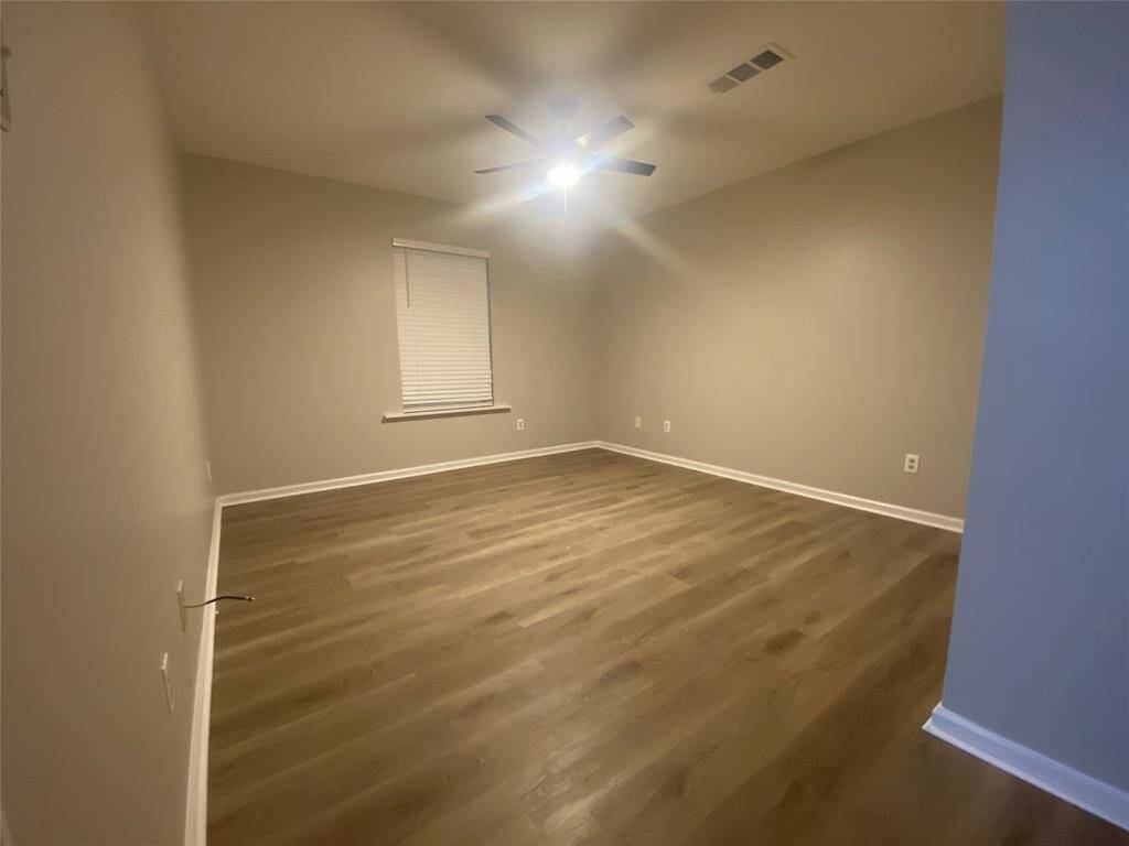 At the end of the hallway you will find the primary bedroom. The bedrooms are relatively similar in size so if you prefer to call the first bedroom the primary - the world is your oyster.