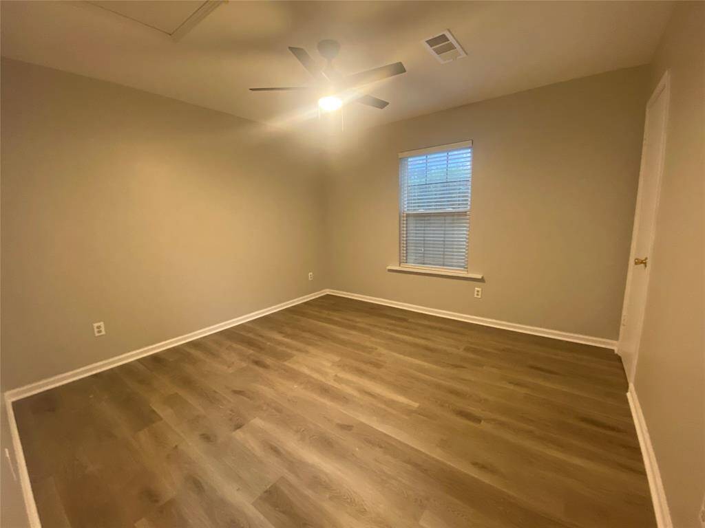 Walking down the hallway, you will come across the first bedroom to your left. This room can fit a queen size bed, or bunk beds. This space could also be used as a home office.