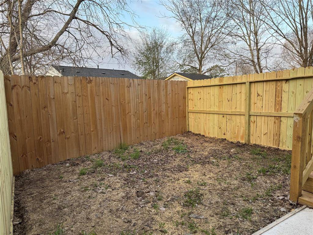 Low maintenance back & side yard with privacy fence, Perfect for relaxation & gatherings.