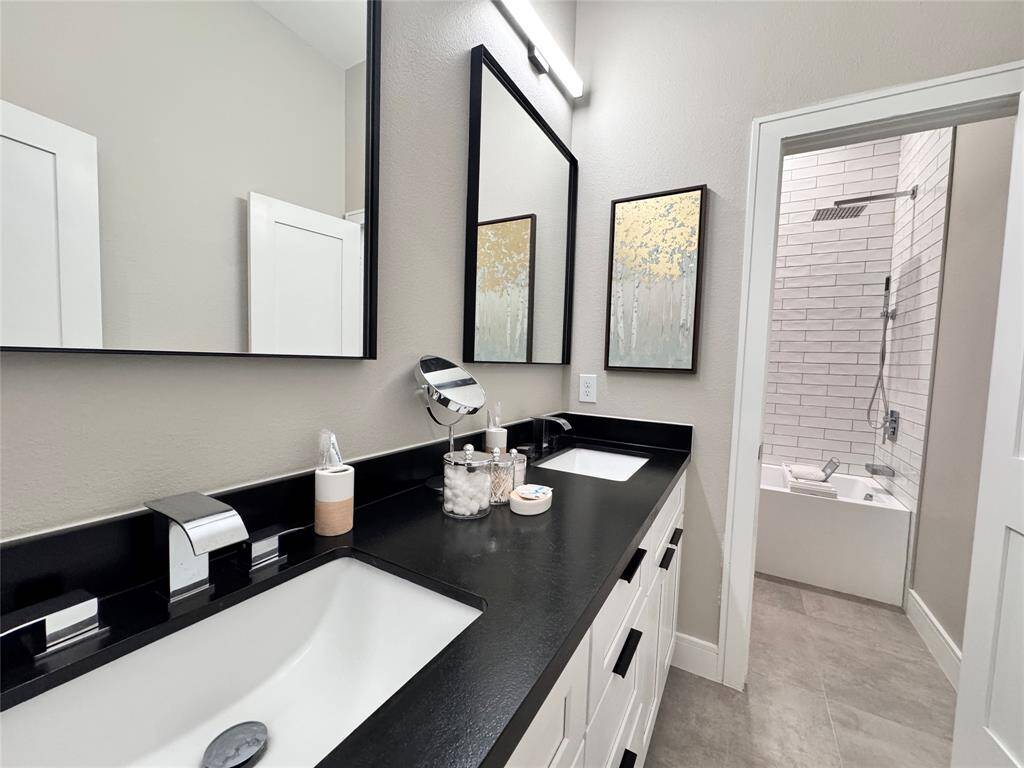 Elegant Bathrooms all include deep soaker tubs and stylish fixtures throughout.