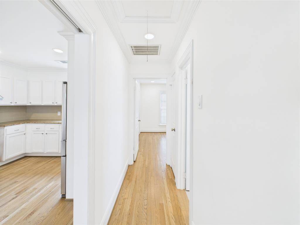 Hallway to other bedrooms and the secondary bathroom.