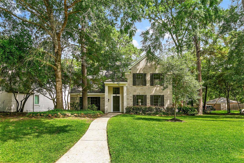Lovely curb appeal with a brick elevation, manicured landscaping, and a covered front entry welcomes you home.