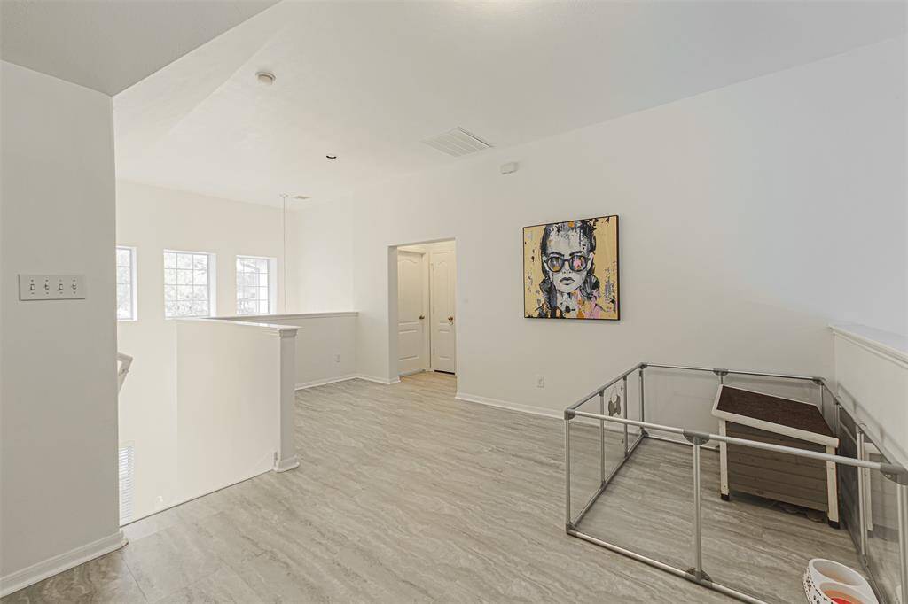 Spacious game room and 3 secondary bedrooms located upstairs.