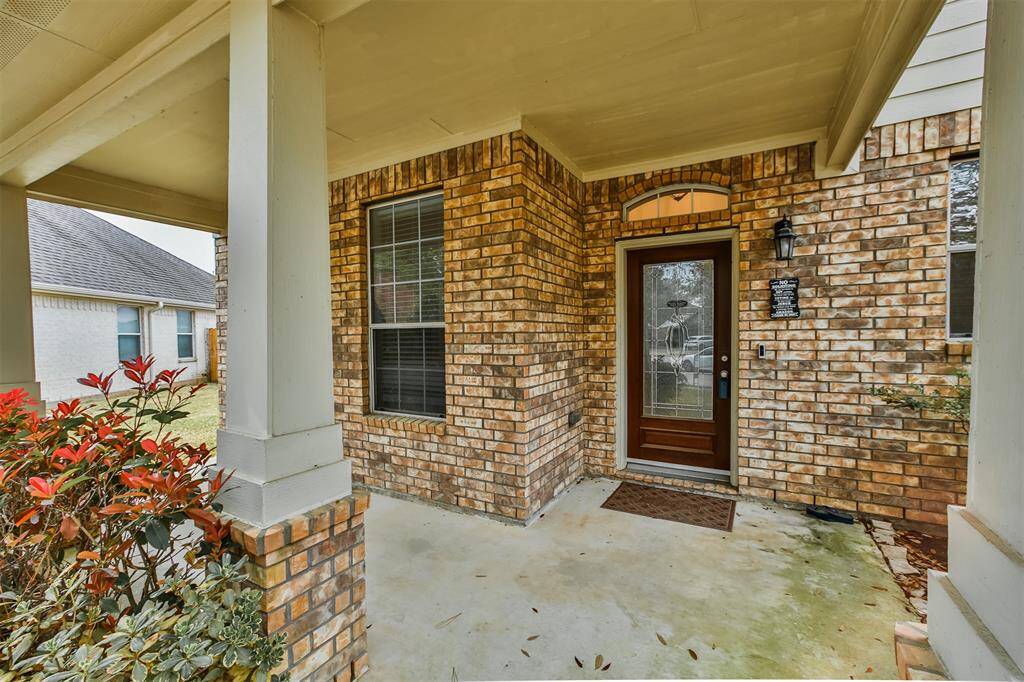 Brick front elevation with covered porch area is great for receiving guests or sitting outside morning or evening.