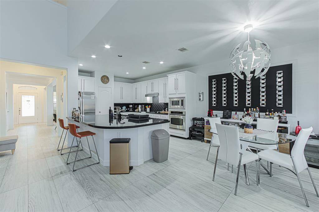 Breakfast nook easily accommodates seating for four.  Additional seating at island for meals on the go.