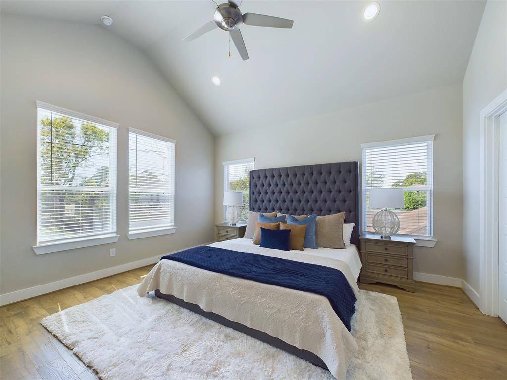 Primary bedroom with vaulted ceilings
