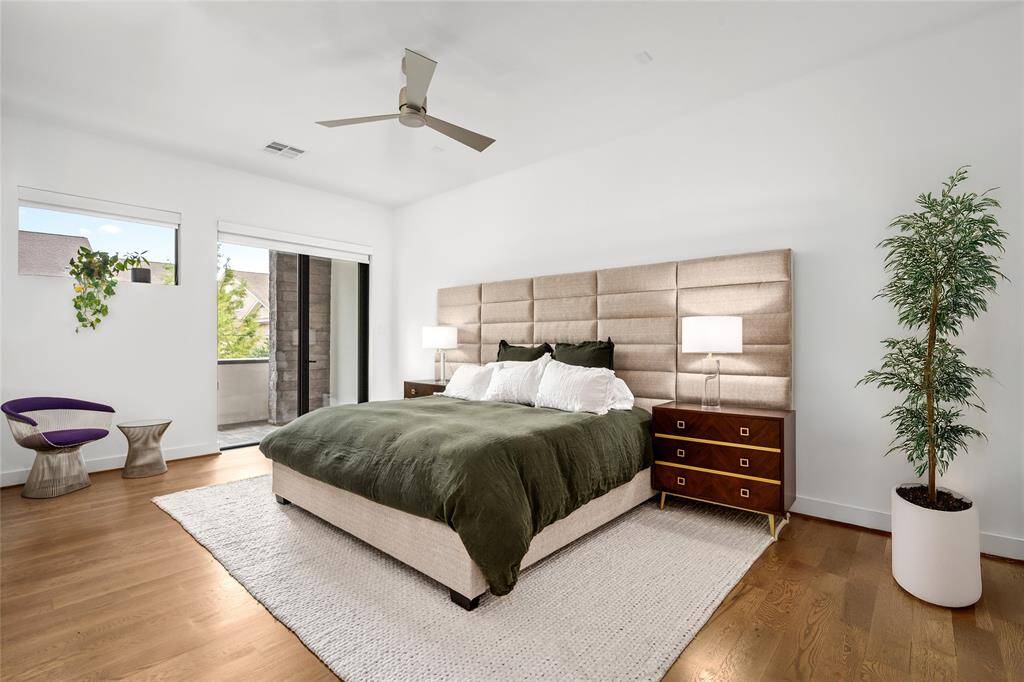 The sunlit primary bath includes a luxurious soaking tub, glass-enclosed shower, double sinks, water closet and ample storage.