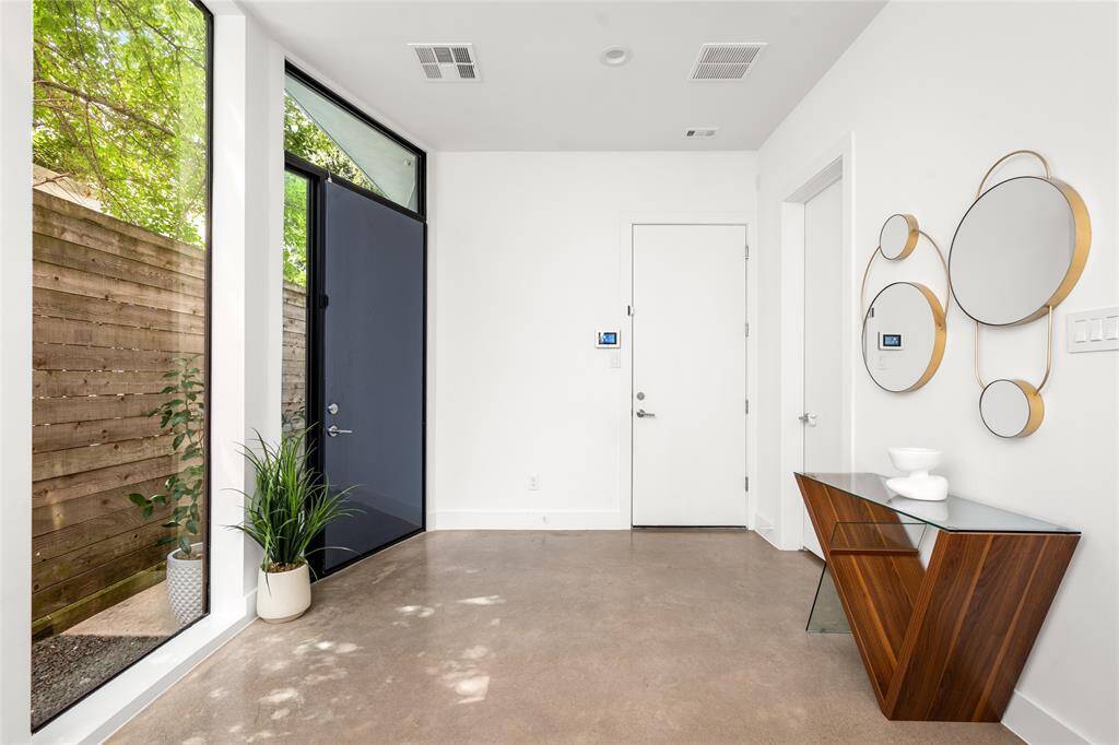 Step inside to a welcoming entryway that sets the tone for the home. Conveniently located here are the garage access and a half bathroom.