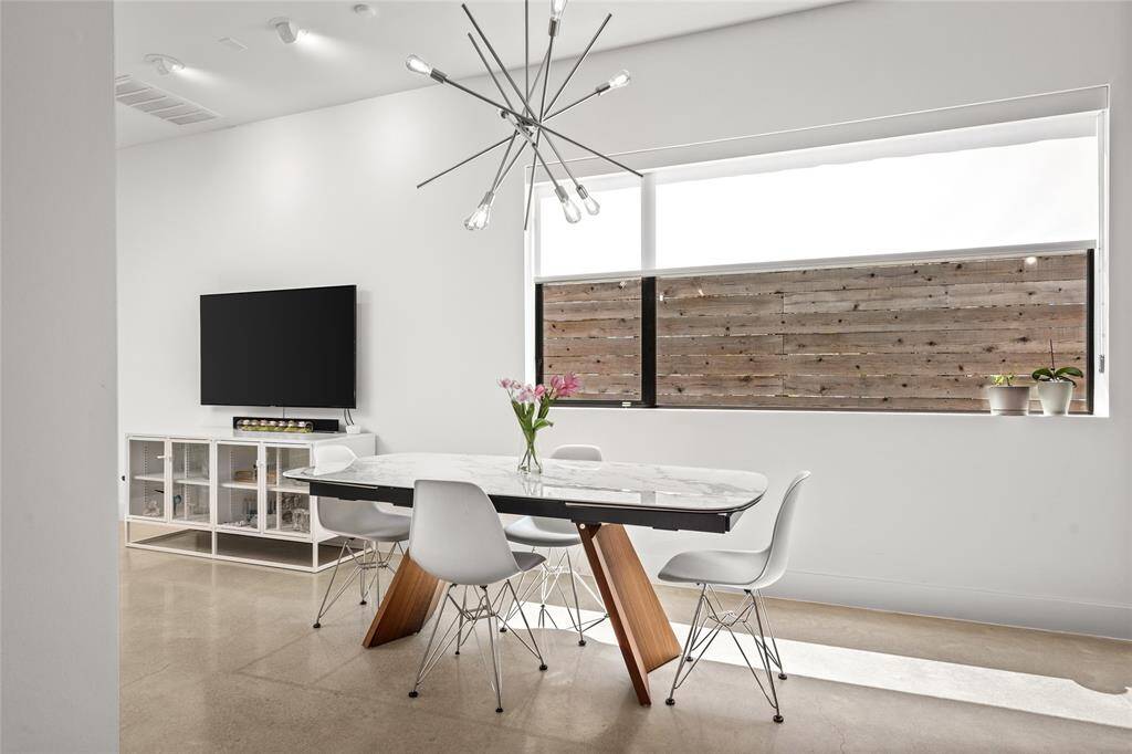 The spacious living room is filled with natural light and offers plenty of room for relaxing or entertaining with ease. The back patio can be seen ahead. Home has french drain & water softening system. *Virtual staging has been added*