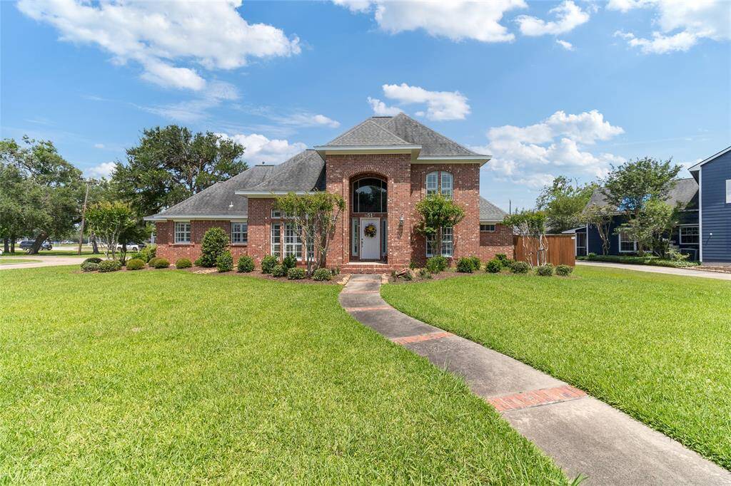Welcome to 51 Oak Hollow Circle—an impeccably maintained red brick beauty situated on a spacious corner lot in a desirable subdivision in Lake Jackson. From the manicured lawn to the inviting arched entryway, this home makes a lasting first impression.