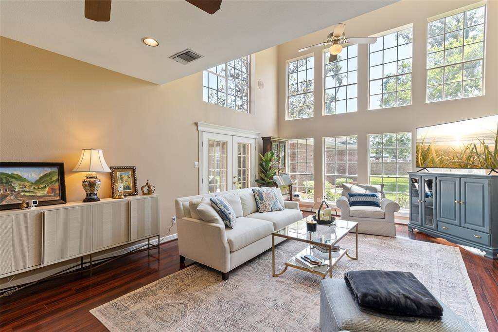 This spacious gathering space features a stunning wall of windows that were recently re-caulked—enhancing energy efficiency while maintaining their crisp, clean finish & picturesque views.