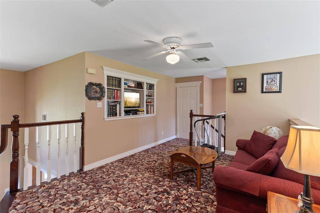 Freshly painted in 2024, this upstairs loft connects both staircases—one leading to the main living area & the other to the kitchen area—creating seamless flow throughout the home from upstairs to down.
