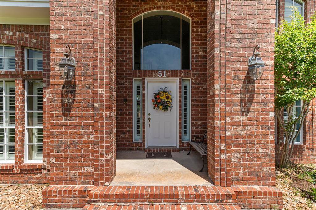 This welcoming front entry showcases the thoughtful craftsmanship of the original, single-owner sellers who custom designed & built the home with timeless detail and care.