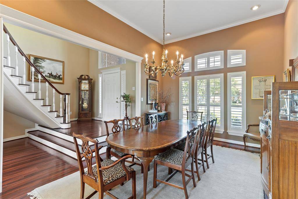 Generously sized formal dining (17x12) offering plenty of space for a large table & seating with elegant plantation shutters on all front-facing windows enhancing both timeless elegance & privacy.