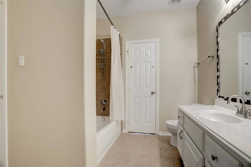 A shared upstairs bath offers double sinks and a shower/tub combo with plenty of space.