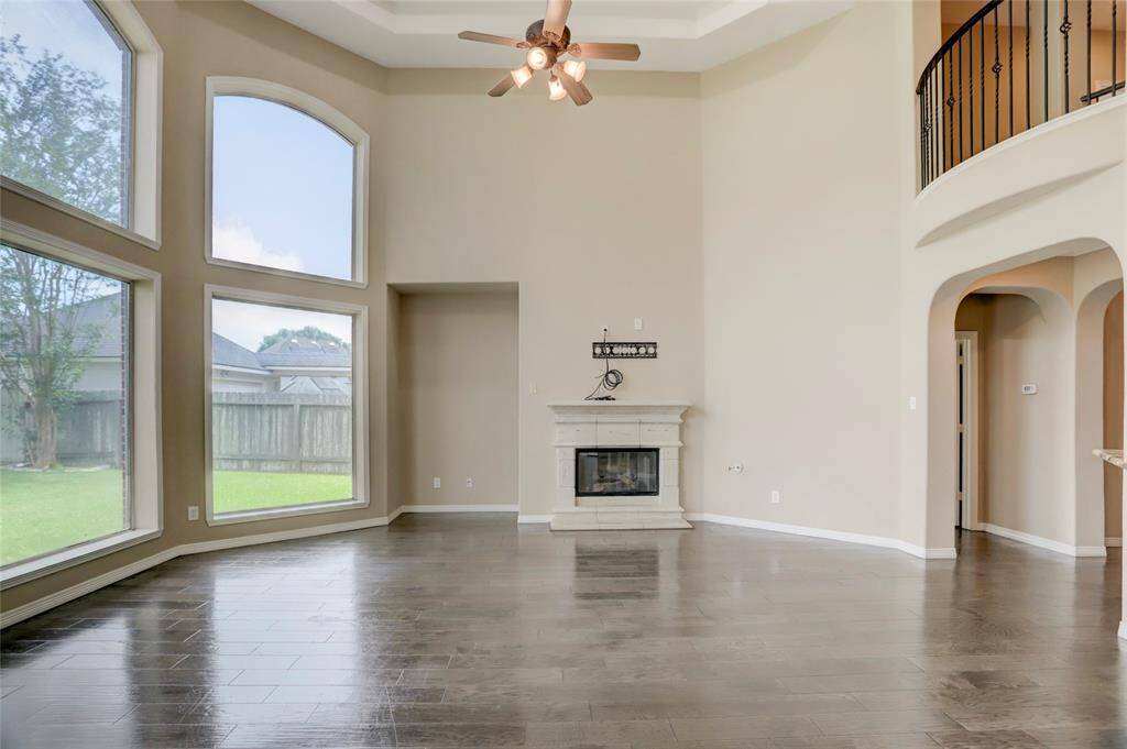 Open and airy, this living room connects seamlessly to the kitchen and backyard for optimal flow.