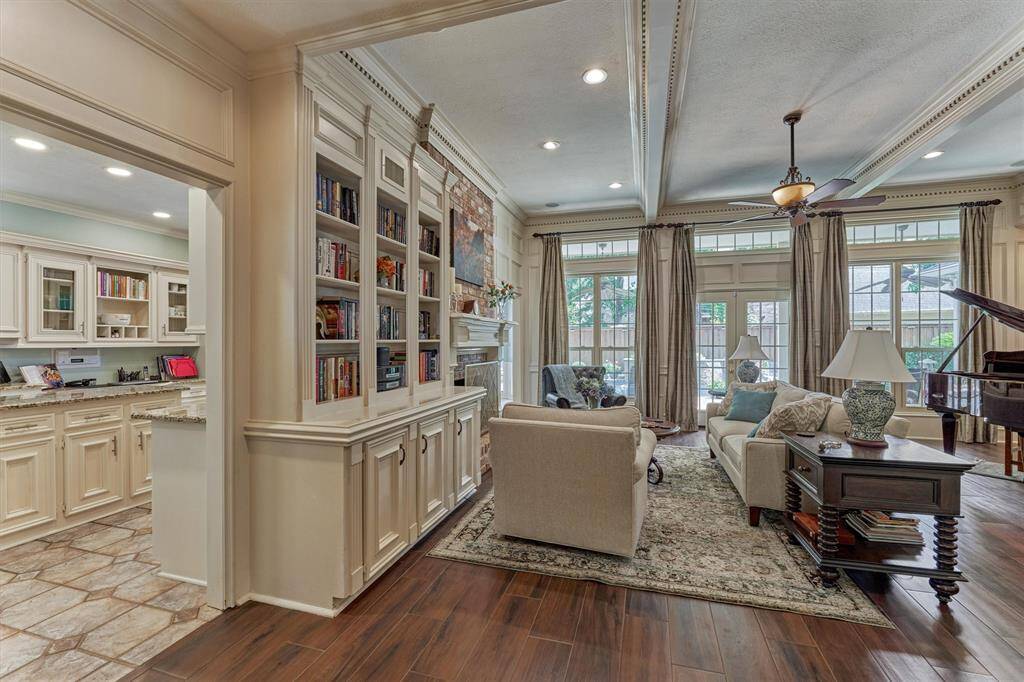 Open-concept living room with custom built-ins and easy access to the gourmet kitchen—perfect for everyday living and entertaining.