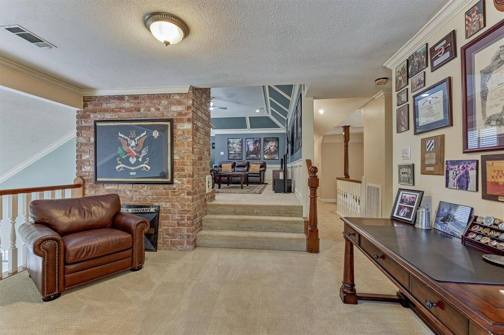 This versatile landing offers easy access to the gameroom and additional upstairs rooms—ideal for displaying cherished memories or creating a quiet study retreat.