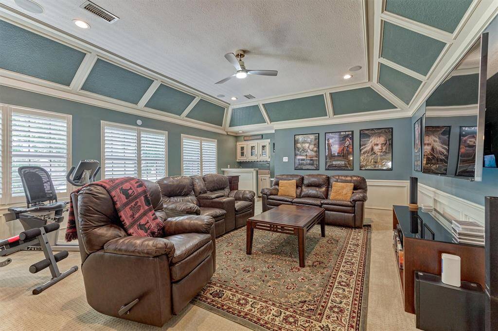 Bright and Inviting. Recently updated with beautiful plantation shutters, this versatile space is full of natural light and comfort—and it overlooks the sparkling pool for a serene backdrop to your downtime.