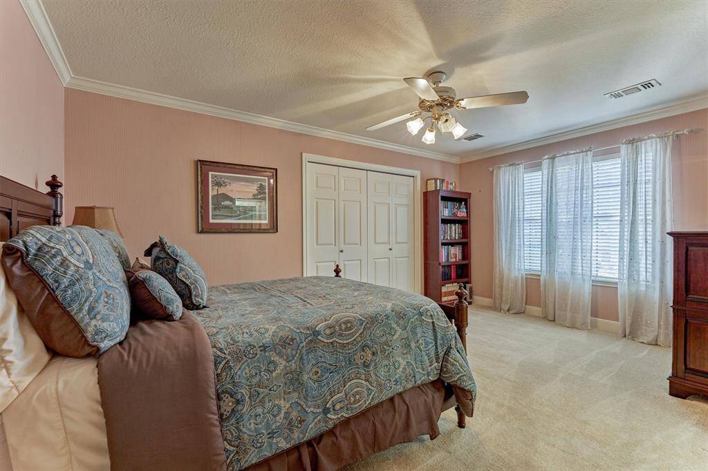 This upstairs bedroom offers direct access to a shared Jack-and-Jill bathroom—perfect for seamless functionality and added privacy.