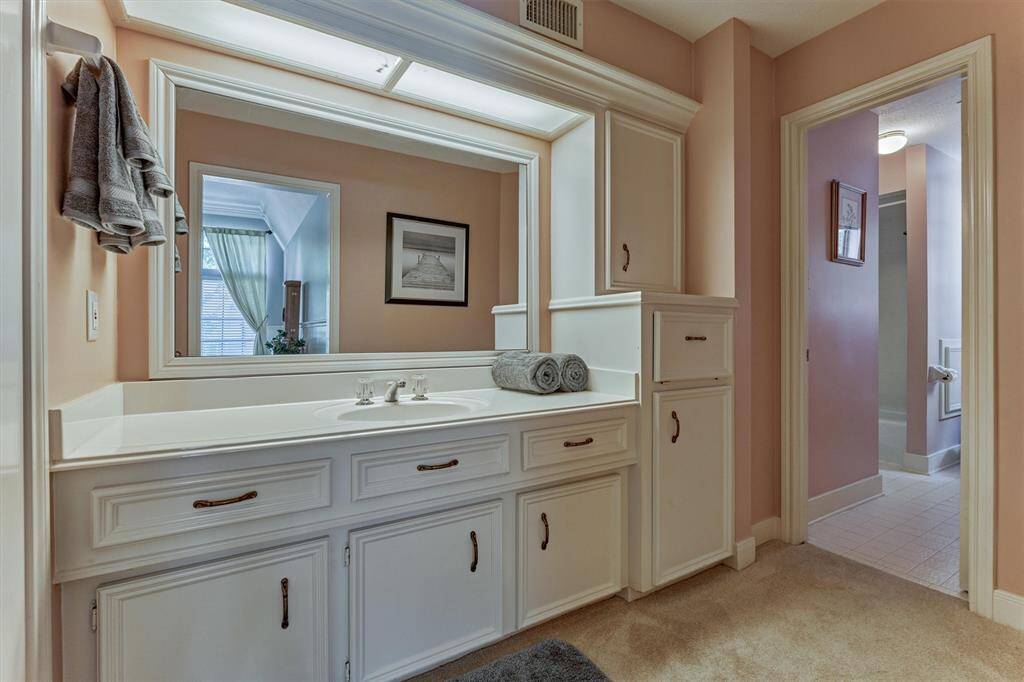 The adjoining flex room shares the Jack-and-Jill layout, making it ideal for guests, a playroom, or even a private office with easy bathroom access.