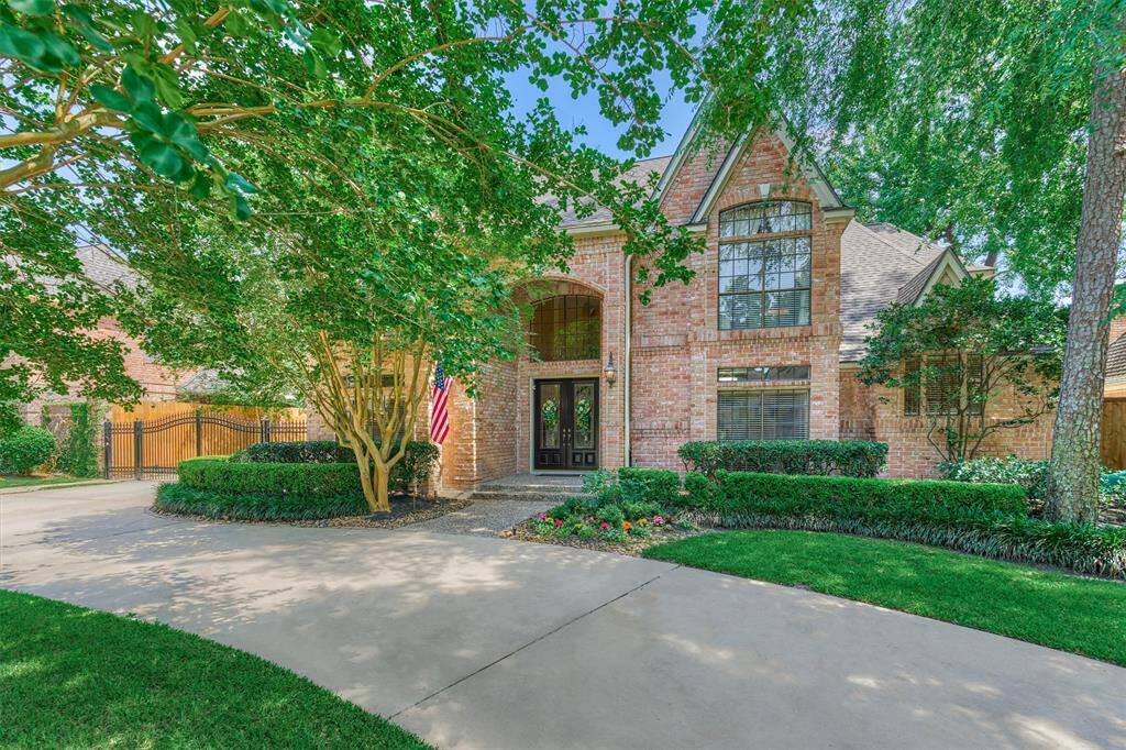Welcome home to this stunning brick two-story, nestled beneath mature trees with a beautifully landscaped front yard and a charming half-circle driveway.