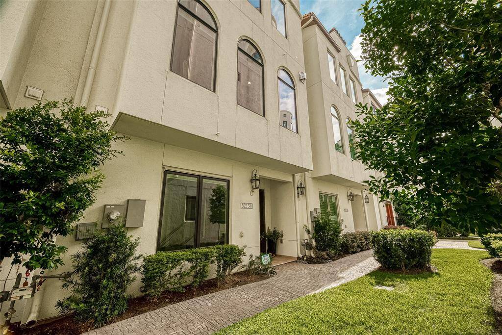 This professionally designed Spanish-style townhome offers 4 levels of luxury living.
