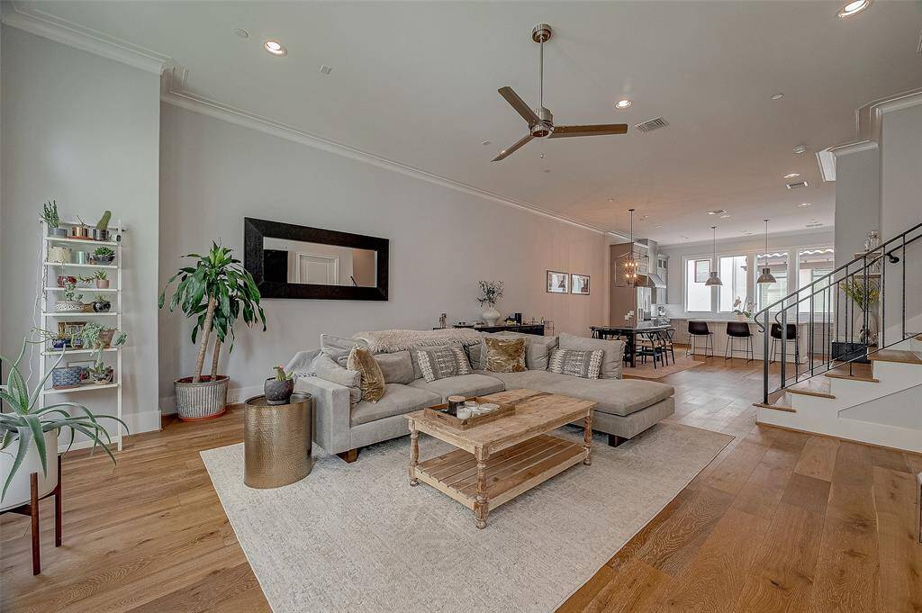 The second-floor living space flows seamlessly into the dining & kitchen areas.