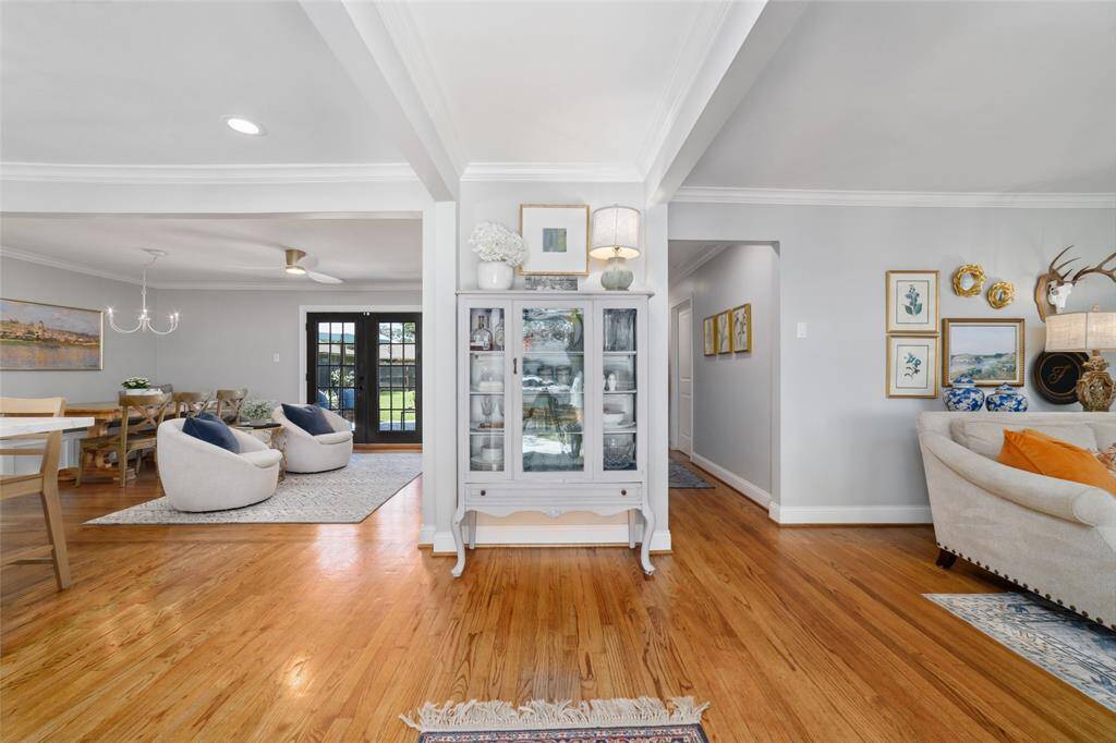 This bright and open floor plan makes it easy to relax, host, or just enjoy a good streaming binge. Large windows, refurbished hardwood floors, and new crown molding create a warm, stylish backdrop for everyday living.