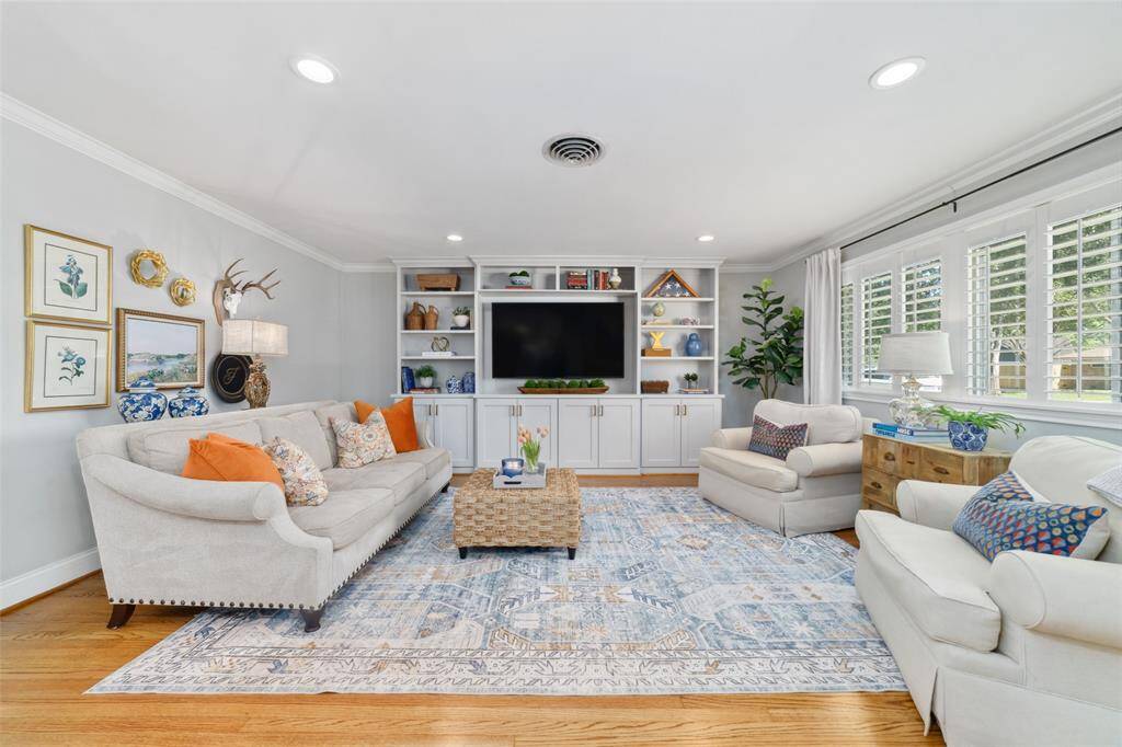 With new and crisp white trim, custom cabinetry, and a smart layout, this family room checks all the boxes. It's equally great for movie marathons, work-from-home days, or wine nights with friends.