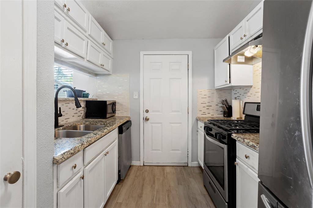 Kitchen with granite countertops.