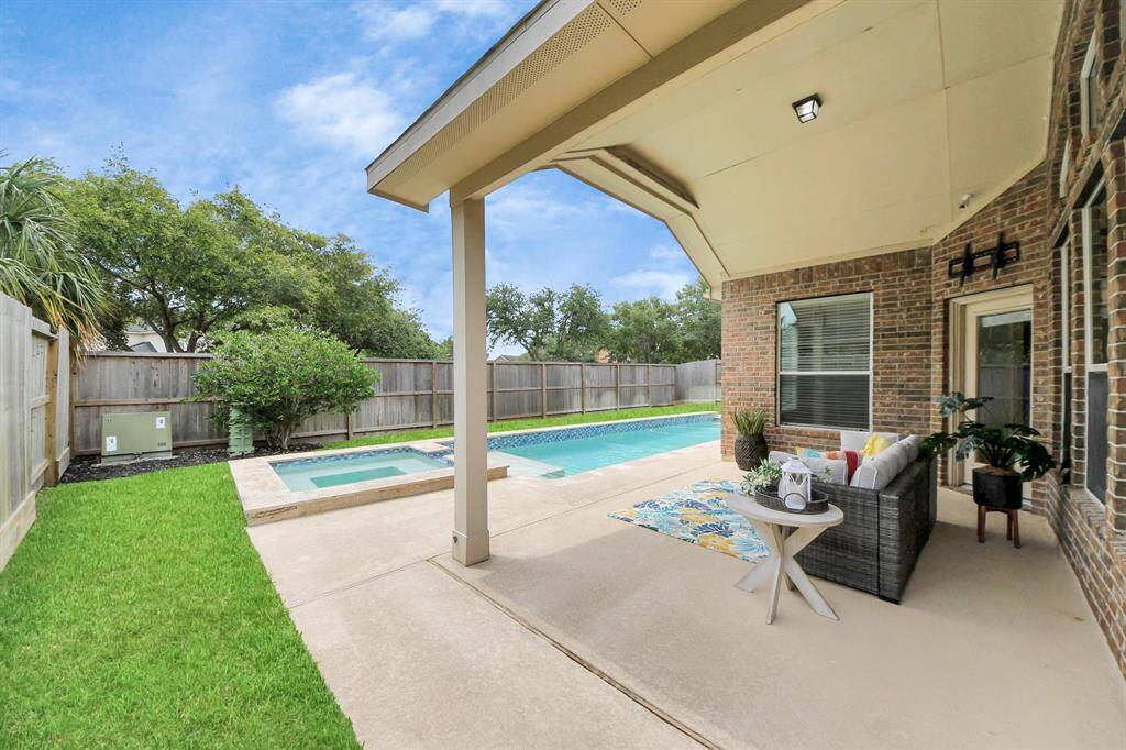 Enjoy summer on those hot days from the covered back patio and pool. Plenty of space for pets and kids to play, as well.