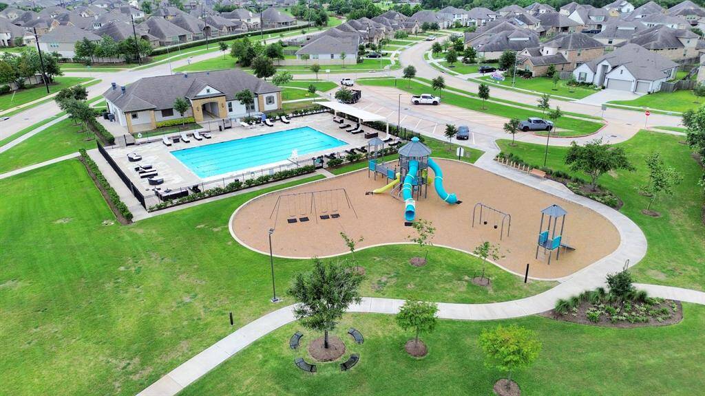 Some of the nearby neighborhood amenities include clubhouse and a large playground. There's a series of parks, quiet arbor sitting areas, and landscaped walking and biking trails.