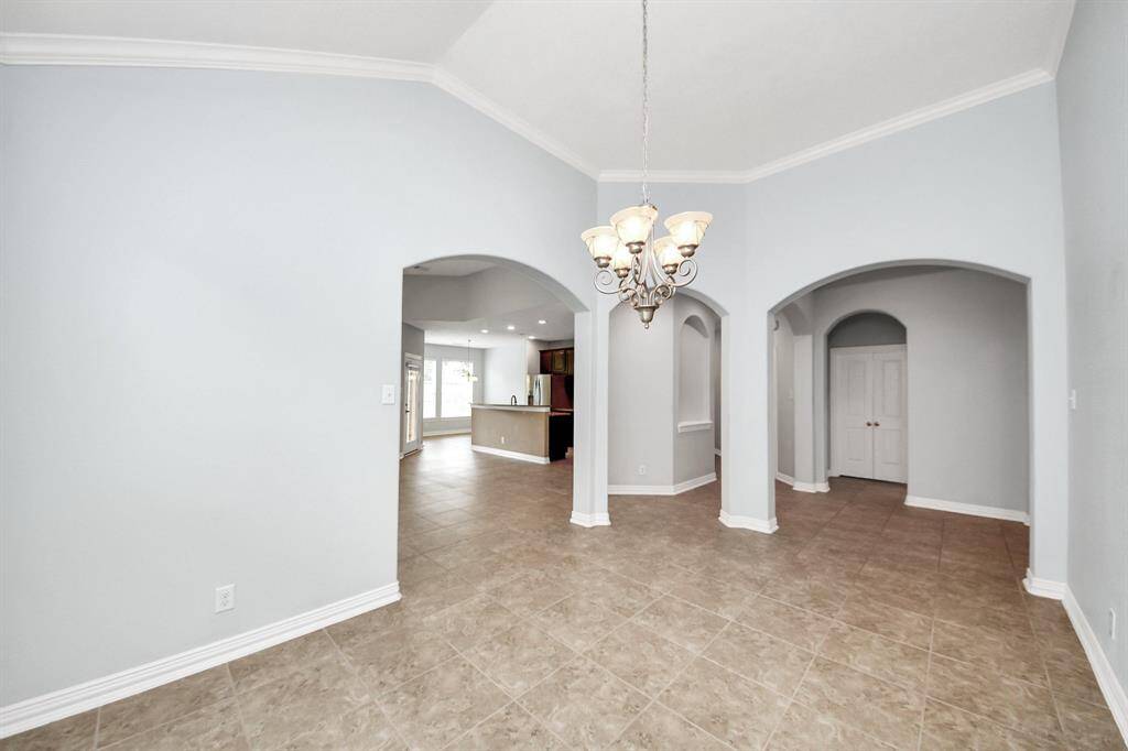 View from dining room to family room and kitchen.