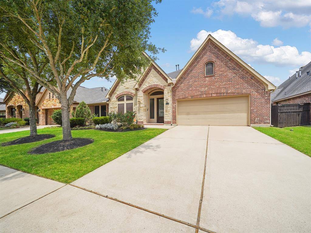 Immaculate 4 bedroom, 3 bathrooom home with two primary suites and backyard oasis with heated pool with spa!