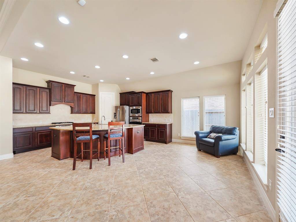 magine enjoying your coffee and breakfast in a bright and airy space. This property features a dedicated breakfast area conveniently located off the kitchen. Large, surrounding windows flood the area with sunshine, creating a warm and inviting atmosphere.