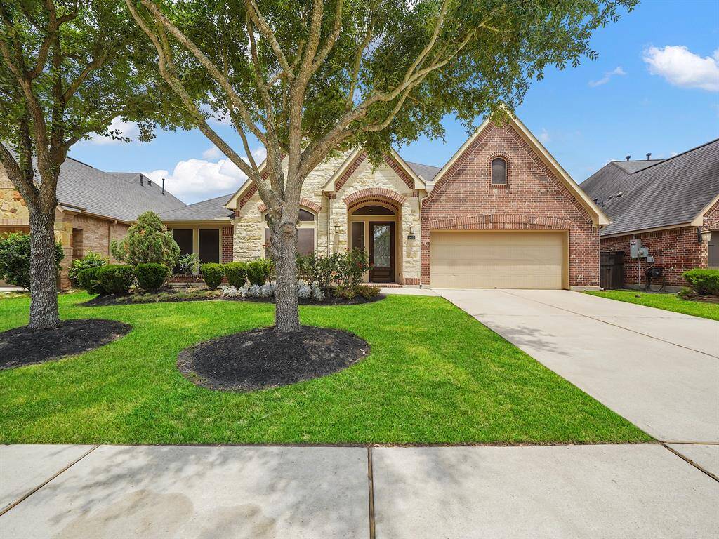 Welcome to this stunning property boasting exceptional curb appeal! Lush landscaping perfectly accents the home's elegant stone and brick exterior. This residence offers a warm and inviting atmosphere, promising comfortable living and a picturesque setting. Don't miss the opportunity to own this gem!