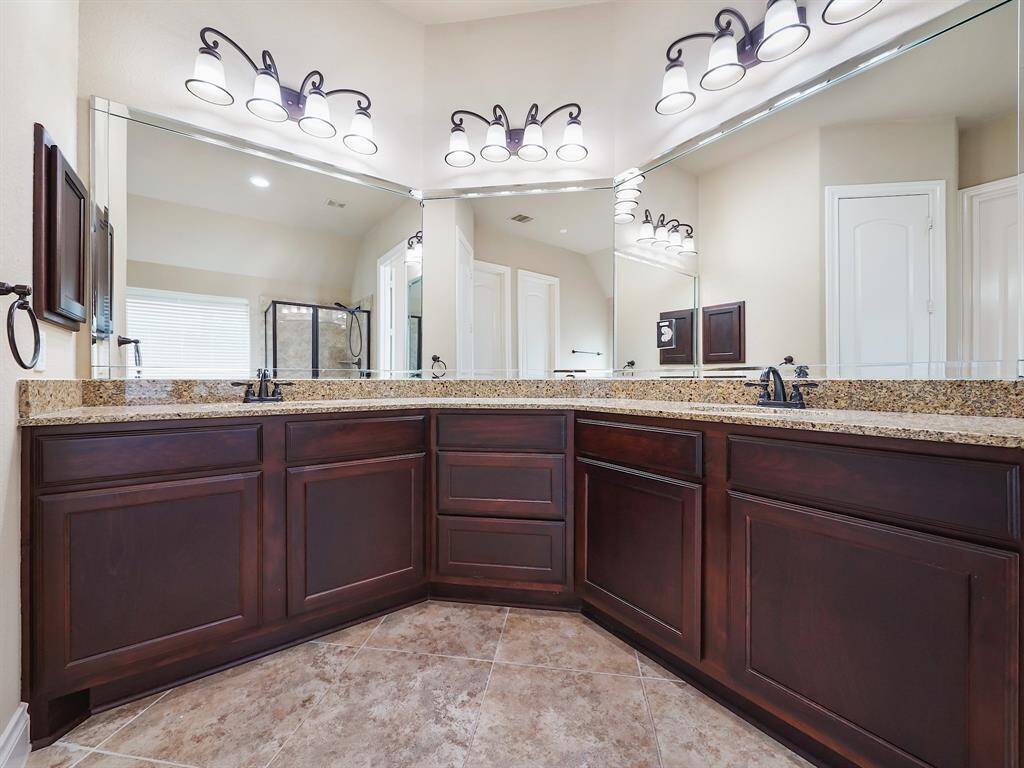 Step into your private oasis with this stunning primary ensuite. The extended vanity, complete with dual sinks, provides plenty of space for your morning routine.