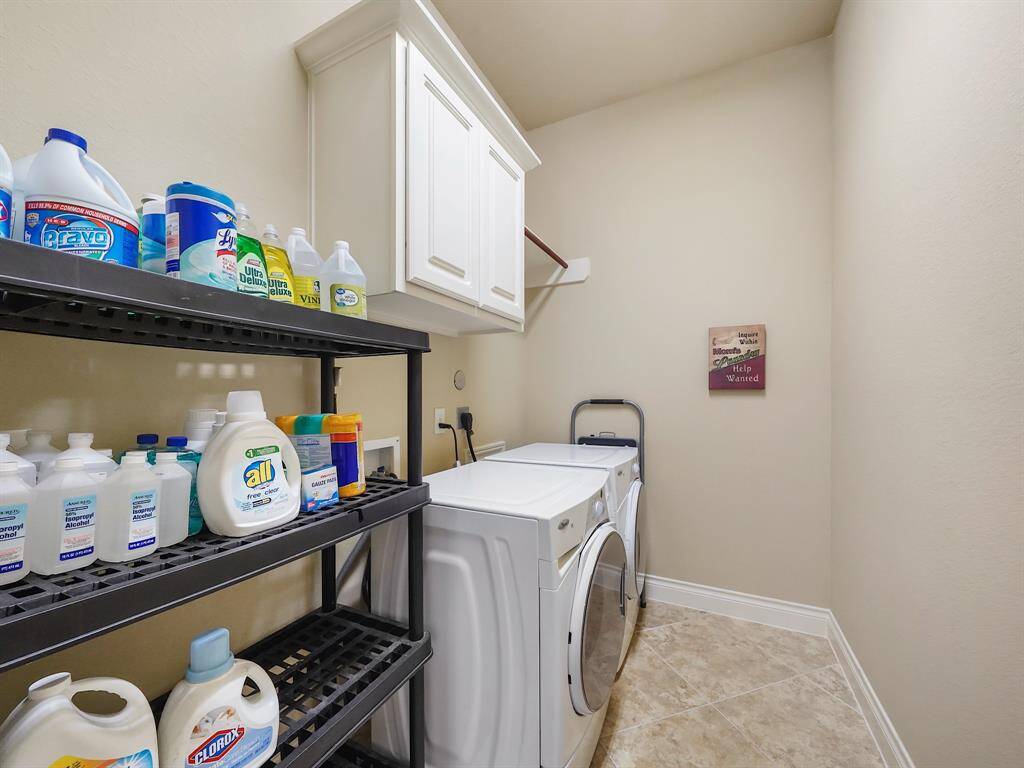 Step inside and appreciate the convenience of a large utility room. Boasting built-in cabinetry and ample additional space, it offers a practical solution for all your storage needs, keeping your home organized and clutter-free.