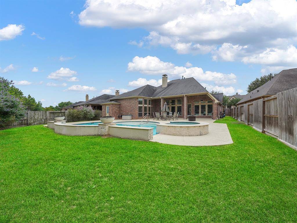 Escape to your own private oasis! This stunning property boasts a sprawling backyard, complete with a sparkling, heated pool and spa – perfect for year-round enjoyment. Entertain in style under the covered patio, and revel in the added convenience of a full bathroom directly accessible from the outdoor space. This is outdoor living at its finest!