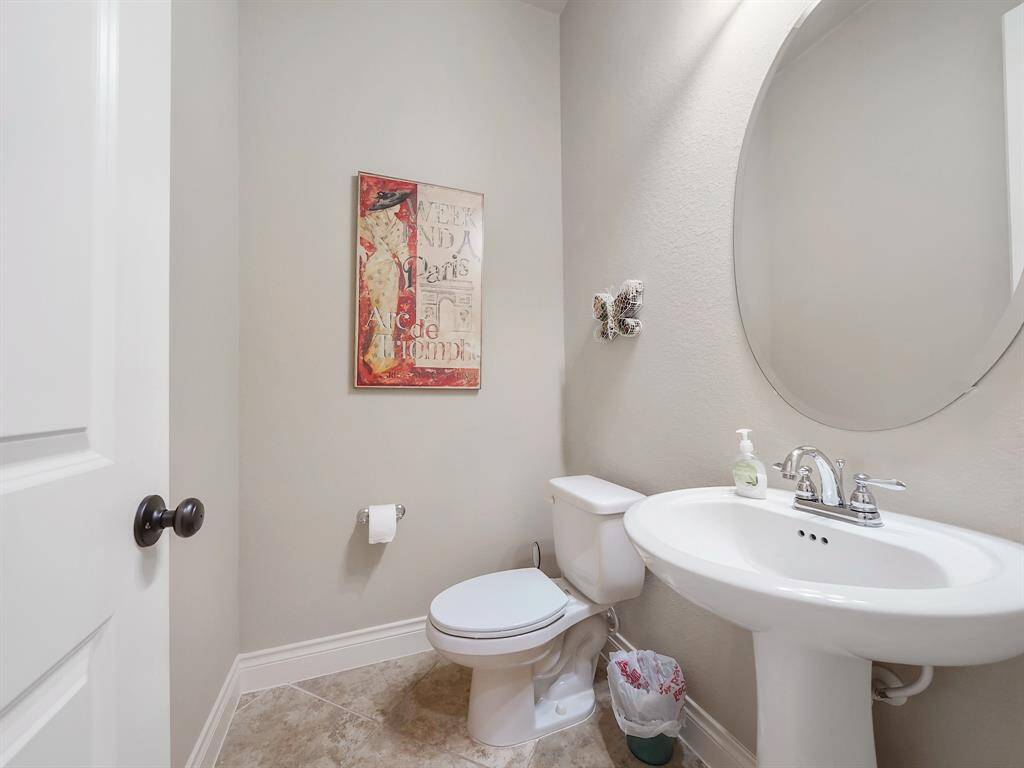 Enjoy the convenience of a half bathroom located just across from the office! Perfect for guests and everyday use.