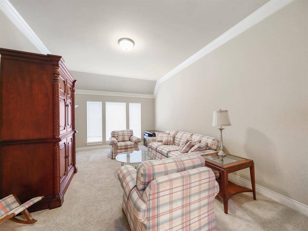 Enjoy a versatile game room with elegant French doors, perfect for entertaining or creating a personalized space. Imagine movie nights, game tournaments, or a quiet retreat.