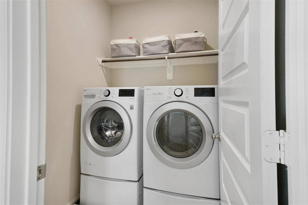 Dedicated laundry space with washer and dryer.