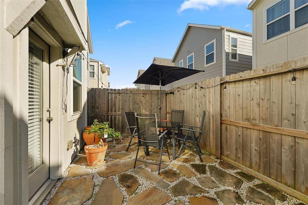 Spacious backyard with private fence, perfect for outfdoor relaxation.